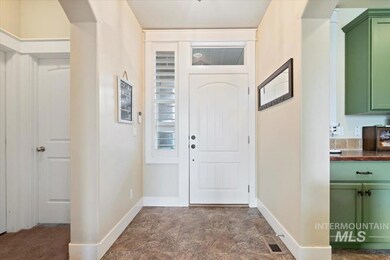 Foyer entrance featuring arched walkways and stone finish flooring