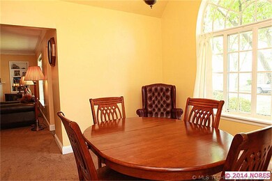 The dining room has a vaulted ceiling that allows