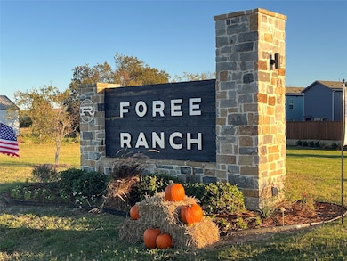 Community sign featuring a yard