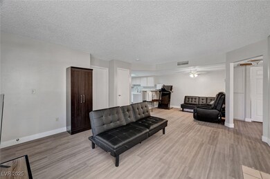 Living area featuring light wood-style flooring, a