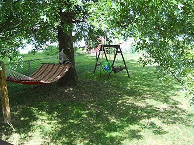 Exterior Back. Completely fenced yard for kids and