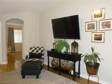 Mounted TV Stays. Archway to Hall & Primary Bedroo