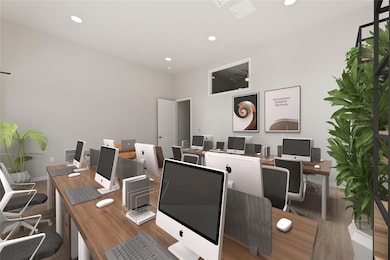 Home office with wood finished floors and recesse