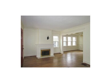 Living room has a fireplace a mount for a flat scr