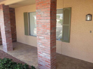 Brick pillar and tiled front patio