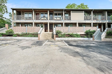 View of building exterior with stairs and uncover