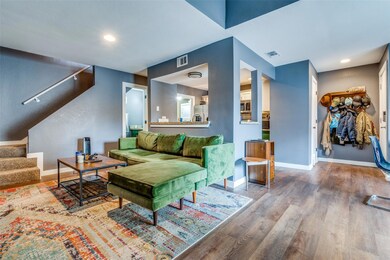 Living room with wood-type flooring