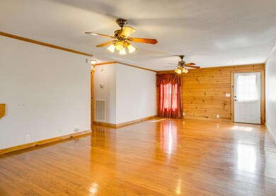 Beautiful wood floors and access to the back deck from  here.