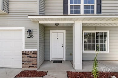 View of exterior entry featuring covered porch