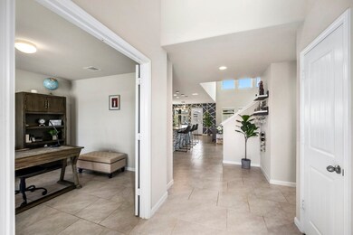 As you walk in you will find the office with french doors on one side and the closet, half bath and laundry room on the other.