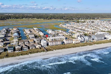 Birds eye view of property with a view of the beac