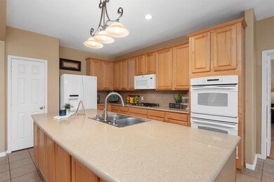 No lack of prep space here.  Imagine all the meals you could prepare and place on this large island space.  All the counter space, the double ovens and the gas range will make any chef happy.