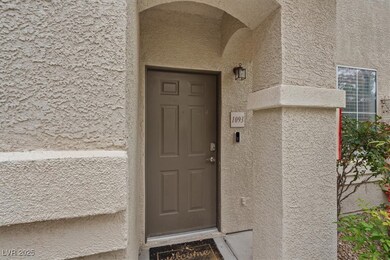 Doorway to property featuring stucco siding