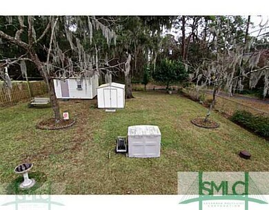 Exterior Back. Fenced in private backyard with sto