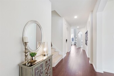 Hall with dark hardwood / wood-style floors