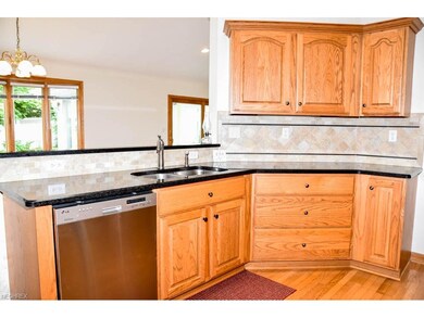 Kitchen has beautiful granite countertops.