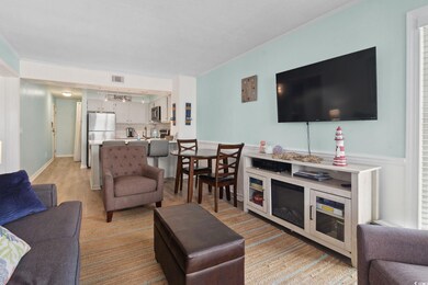 Living area featuring ornamental molding