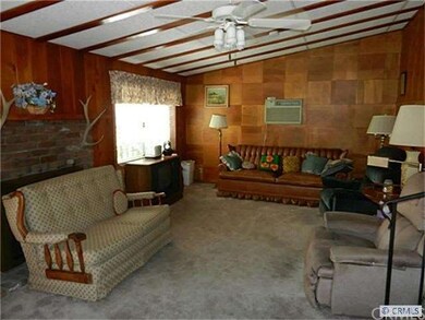 Family Room with Vaulted Ceiling Looks Out to Park