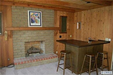 Large Family Room with a Bar & Fireplace