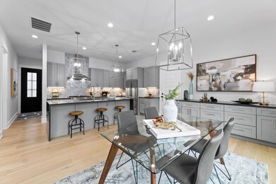 Dining room featuring a notable chandelier, reces