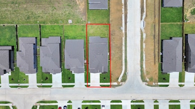 An aerial view of a spacious corner lot, highlight