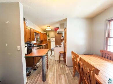 Interior space featuring a textured ceiling and li