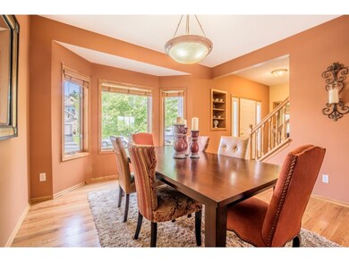 Formal dining room boasts large windows.