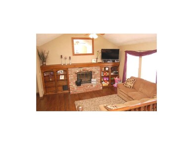 Wood floor, wall-to-wall built-ins and mantel, lig