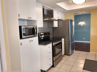 Updated kitchen (2015) features tile floor, stainl