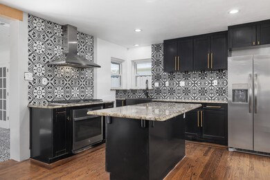 Kitchen has been freshly renovated ! All Doorways are widened to both ---fabulous granite--large fridge and gold accents. Beuatiful stainless hood and 6 gas burner . Black cabinets and gold puls-recess lighting