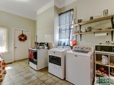 Downstairs kitchen; tile floor, washer and dryer h
