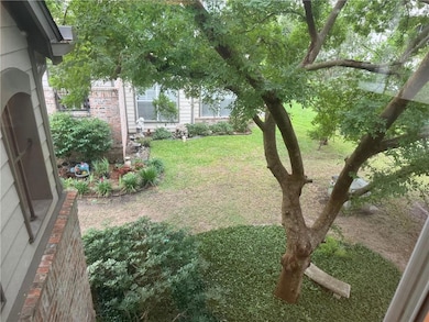 View of the tree & landscaping from the windows.
