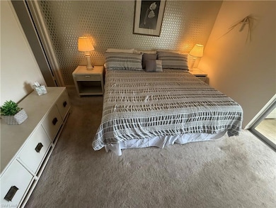 Bedroom with carpet flooring