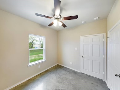 Spare room featuring ceiling fan