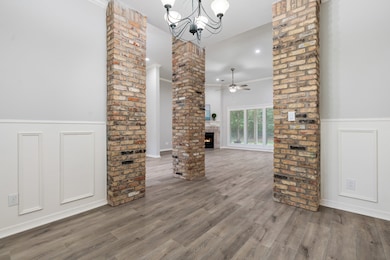 This entryway features a rich wooden front door wi