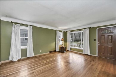 Living room and windows providing natural light.