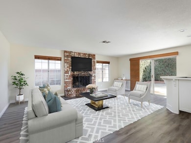 Family Room with fireplace & new flooring.