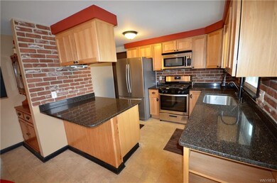 Terrific eat-in kitchen with hickory soft close ca