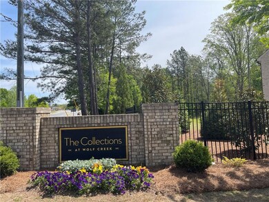 Monument sign and seasonal flowers to welcome you 