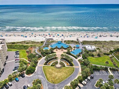Birds eye view of property featuring a beach view 