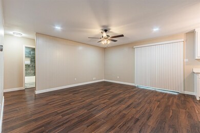 Unfurnished room with dark wood-type flooring, cei