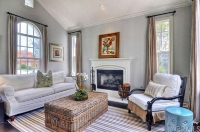 Formal living room with pitched ceilings and frenc