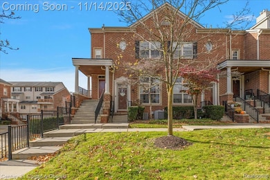 View of front of property with brick siding and a front lawn