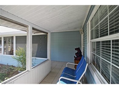 Wrap around screen front porch with tile floor