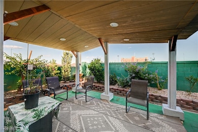 Fenced backyard with a patio area