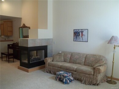 Living room with gas fireplace.