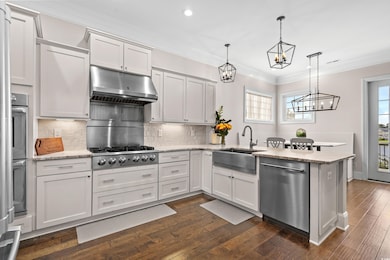 Kitchen with stainless steel appliances, white cab