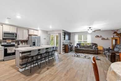 Kitchen featuring a breakfast bar area, a center i