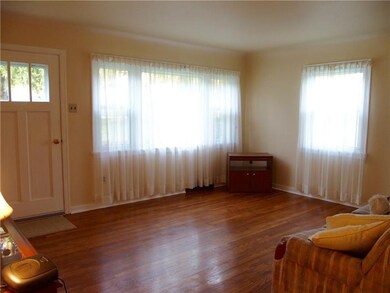 Gorgeous Hardwood and lots of light in this charmi