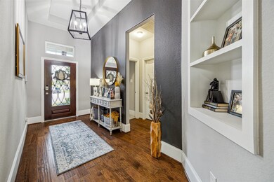 The front entrance comes equipped with an eye-catching accent wall. Also, note the upgrade 8